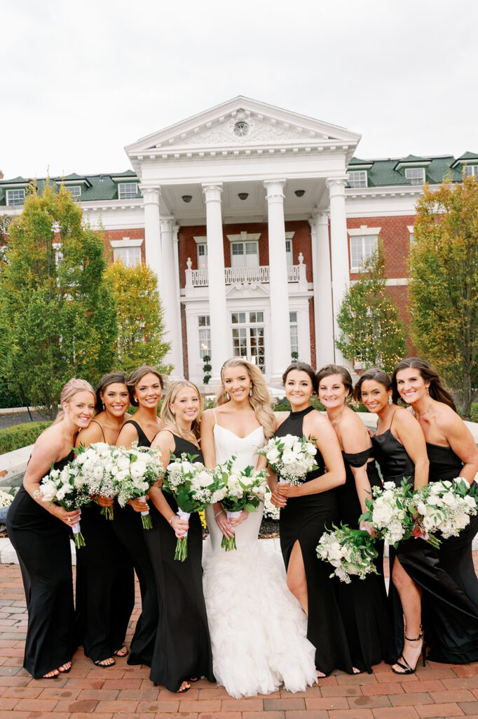 All black bridal party group photo outside the Bourne Mansion.