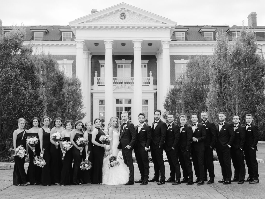 Sophisticated black and white wedding party group photo.