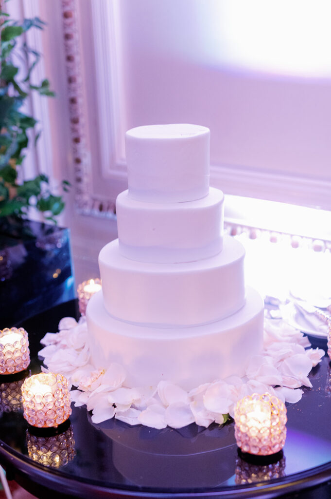 4-tier simple and plain white wedding cake.