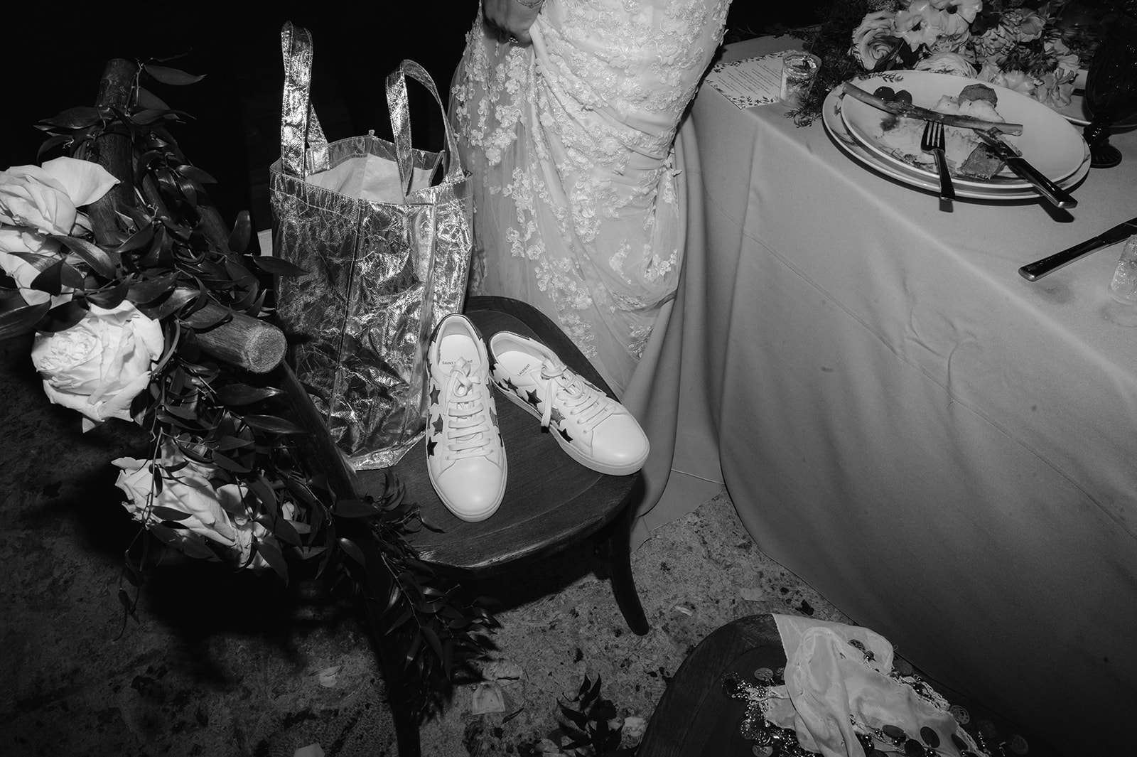 Bride changing into sneakers for the dance party.