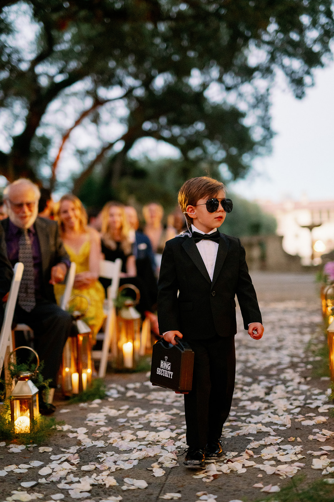 Ring bearer dressed as a security guard.