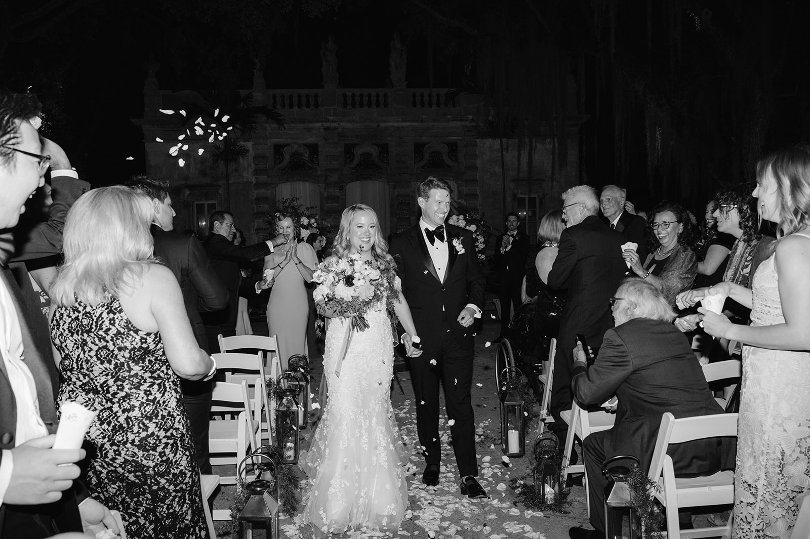 Bride and groom recessional and flower petal toss.