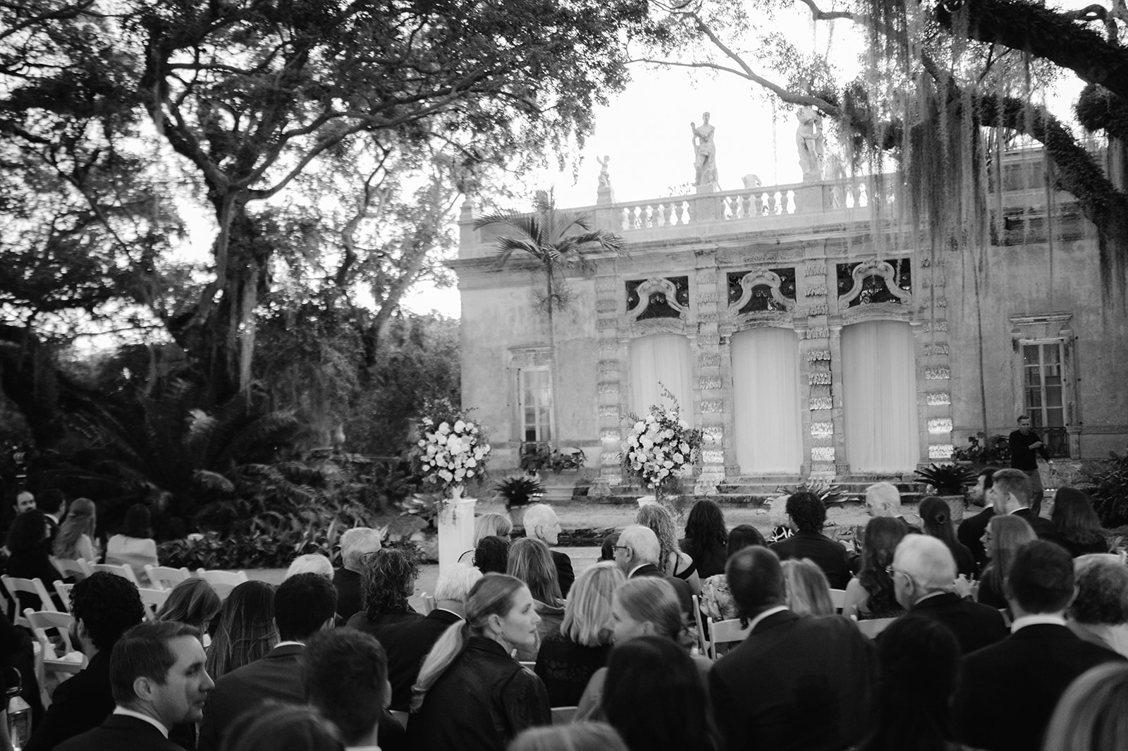 Luxury wedding ceremony at Vizcaya Gardens.