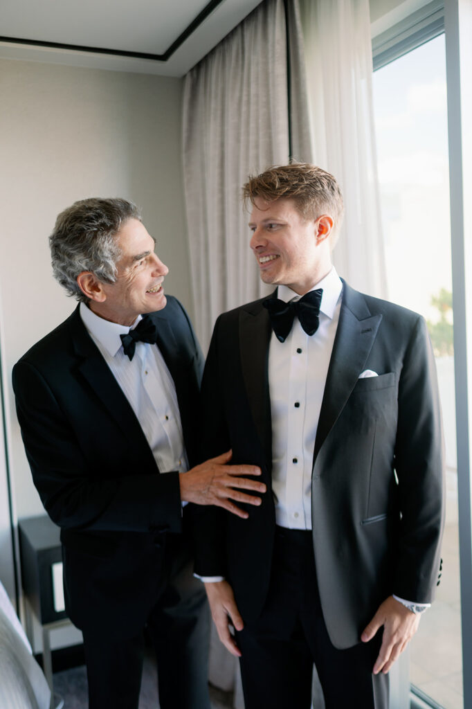 Candid groom and groom's dad portrait.