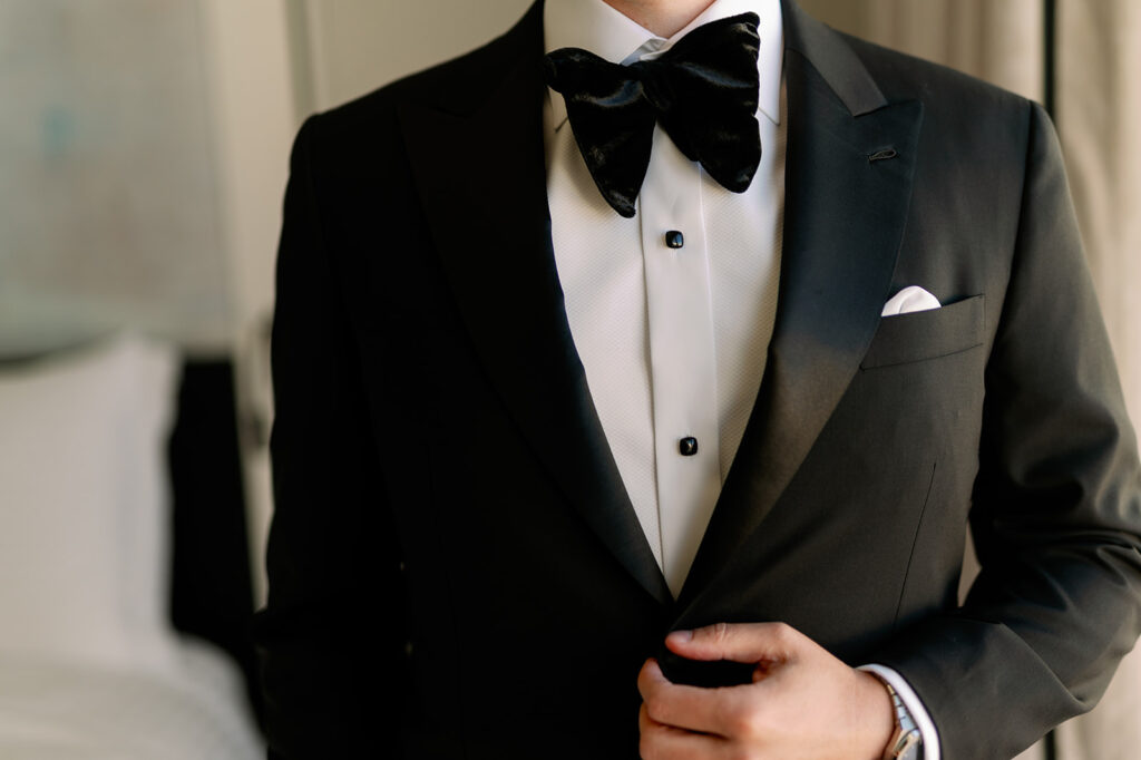 Classic black groom attire.