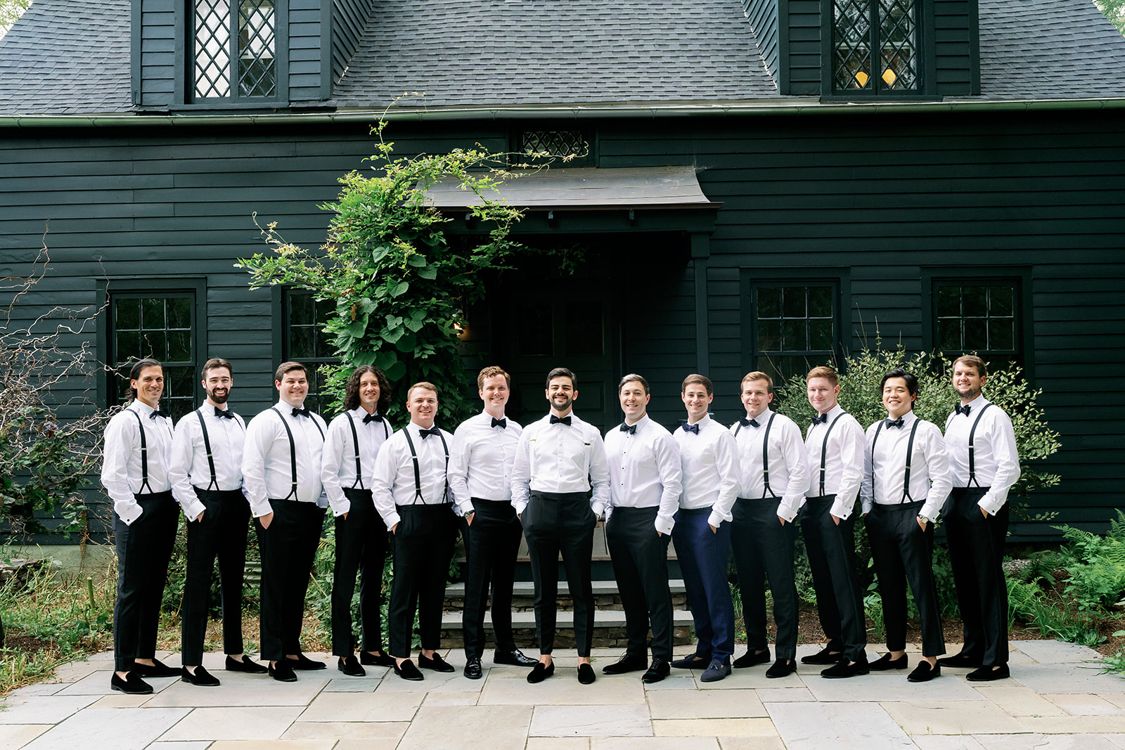 Groomsmen group photo outside the Benton House at Troutbeck in Hudson Valley. 