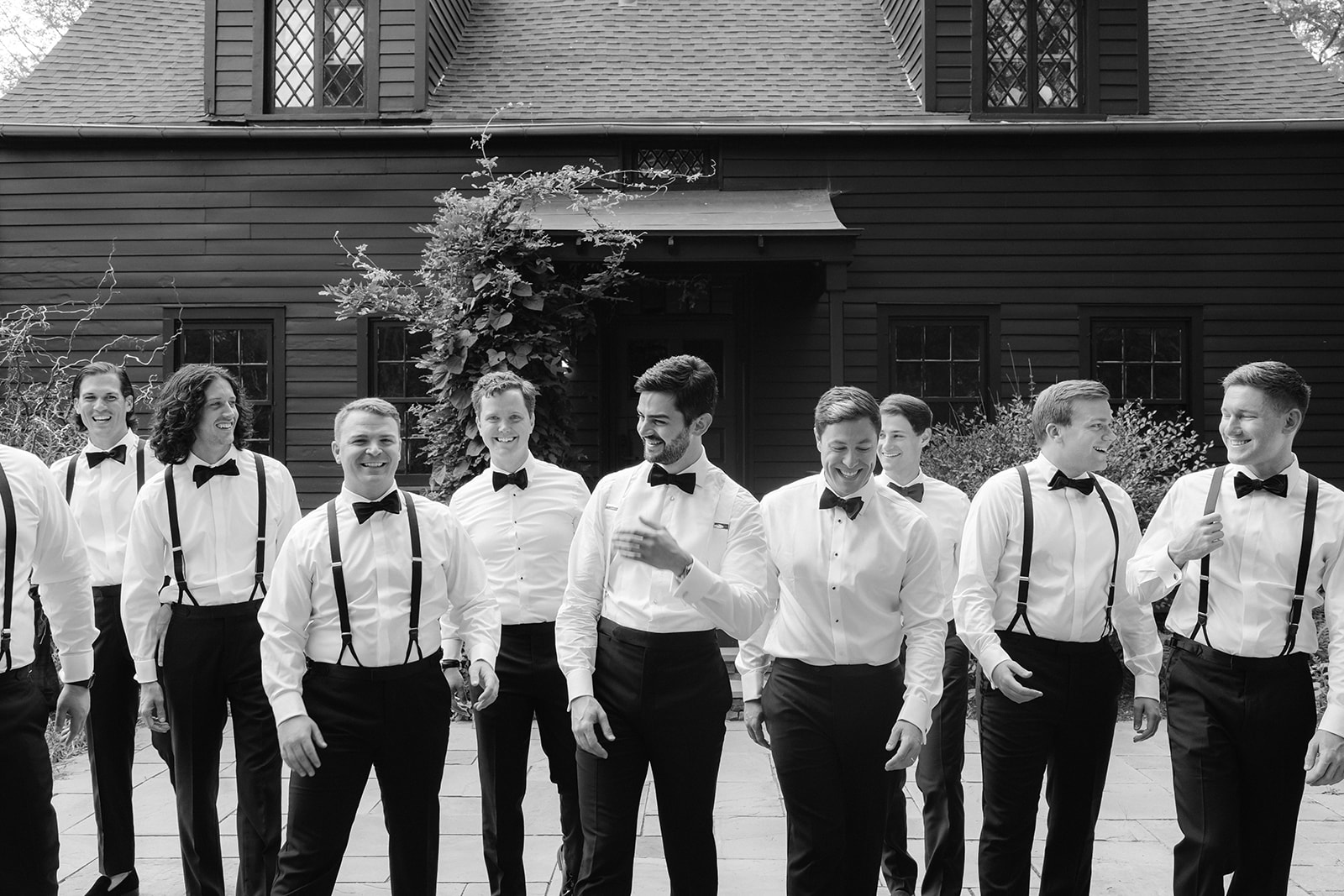 Candid, documentary-style groomsmen group photo.