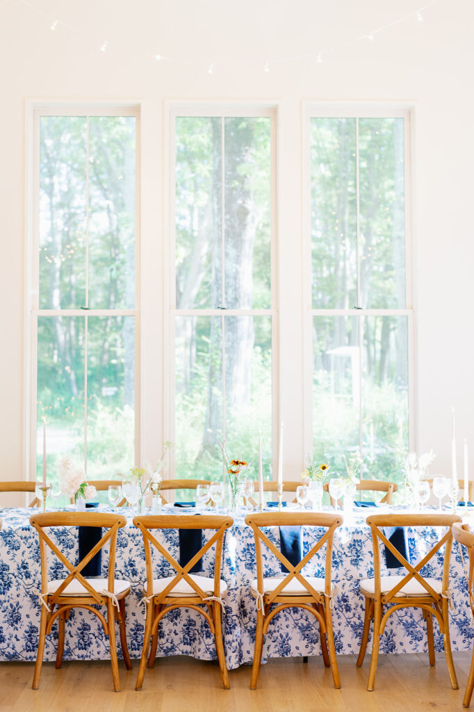 Romantic blue and white wedding rehearsal dinner tables. 