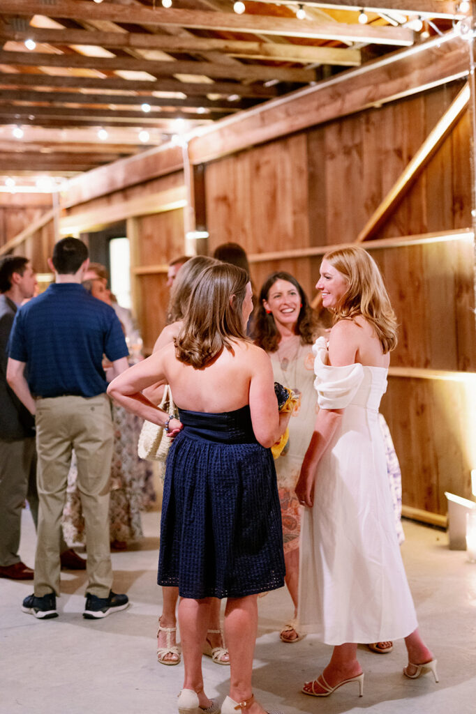 Bride mingling with guests at her wedding welcome party.
