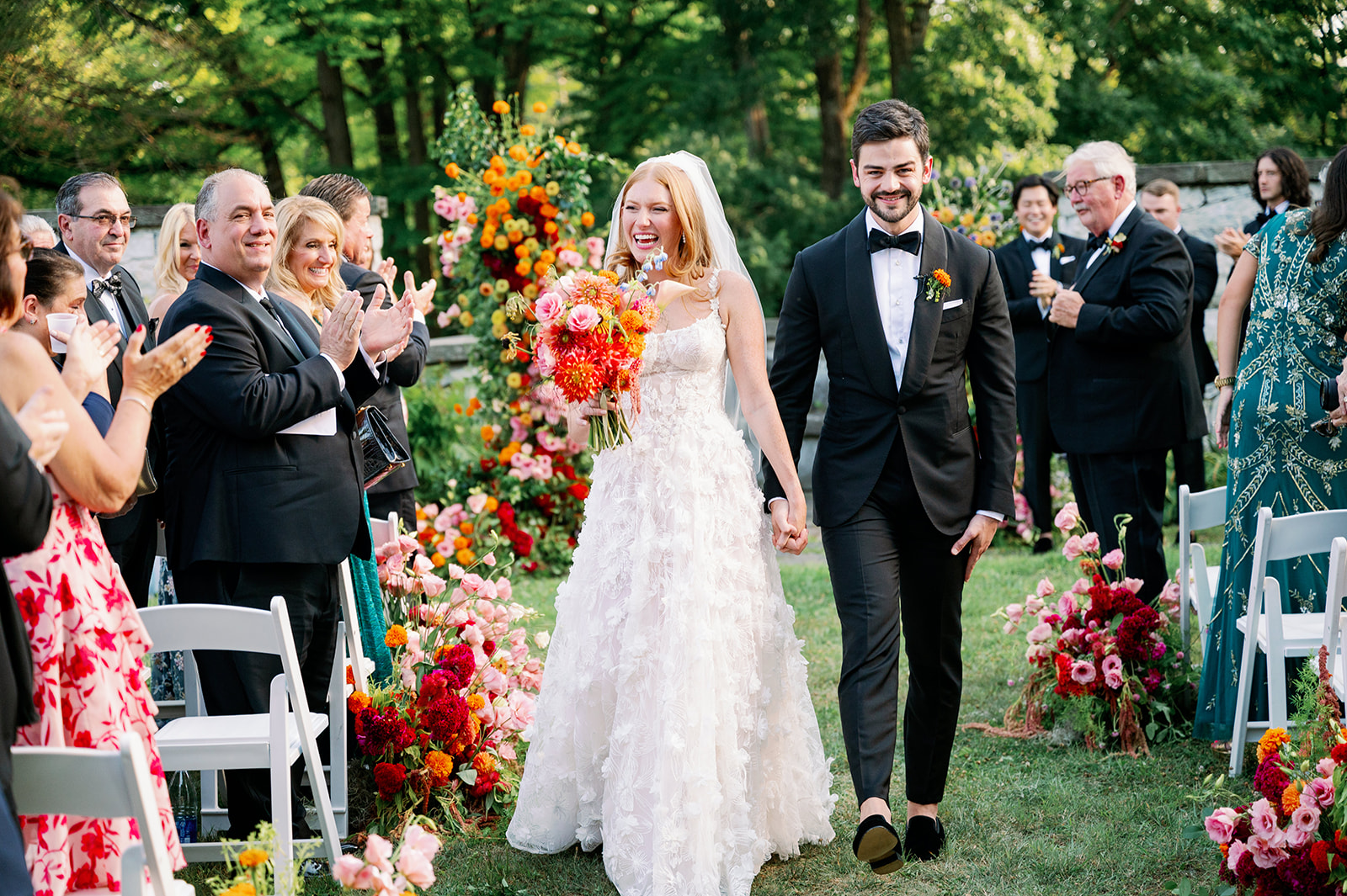 Whimsical floral wedding bride and groom ceremony recessional.