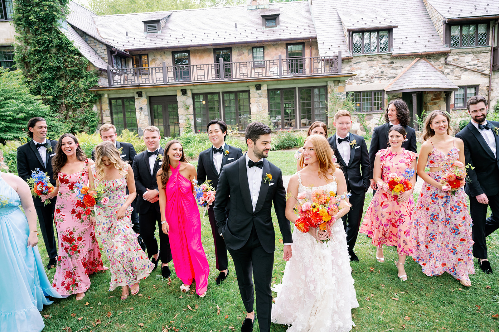 Vibrant floral summer wedding party at Troutbeck. 