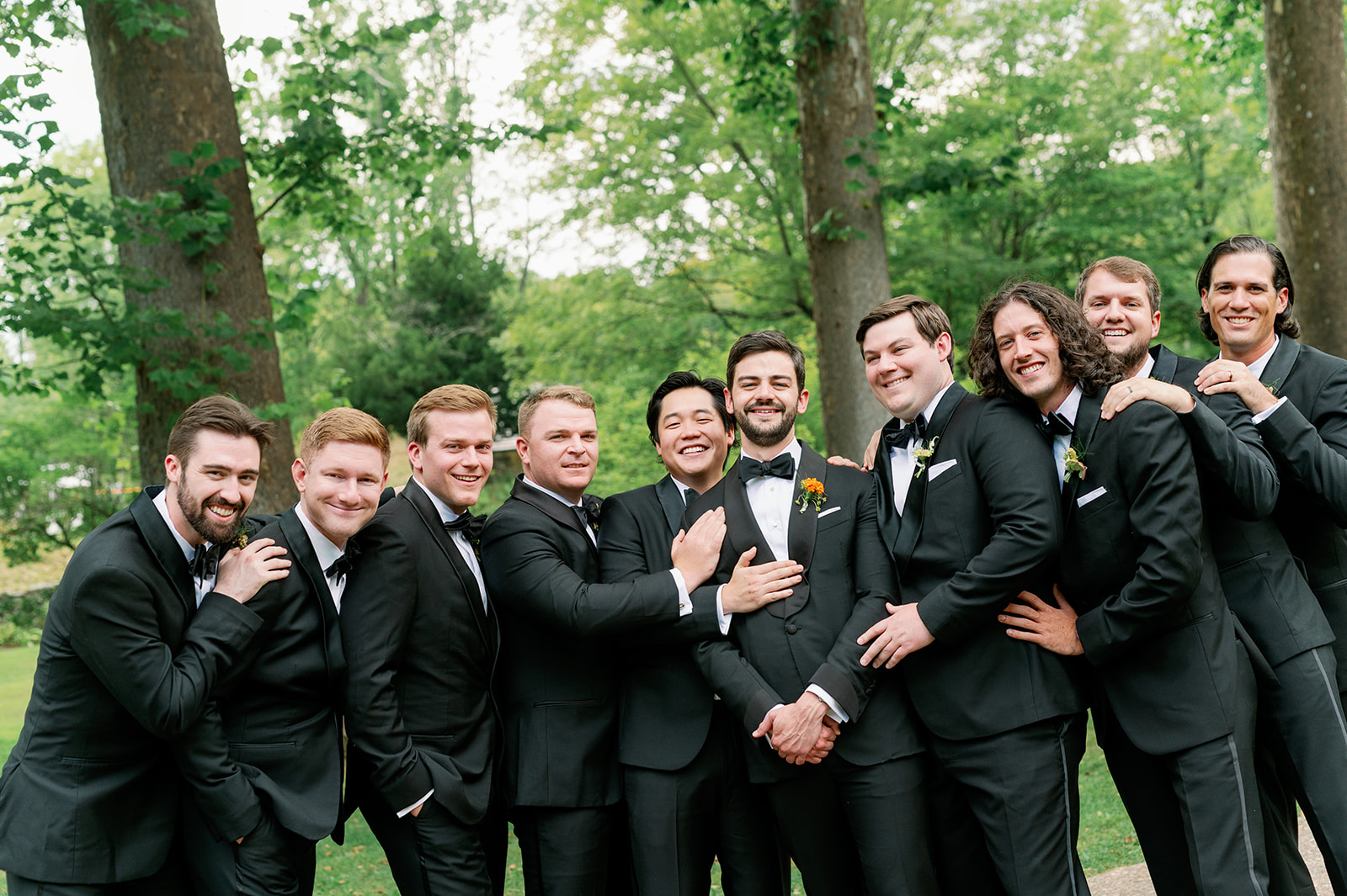 Candid groom and groomsmen group photo.