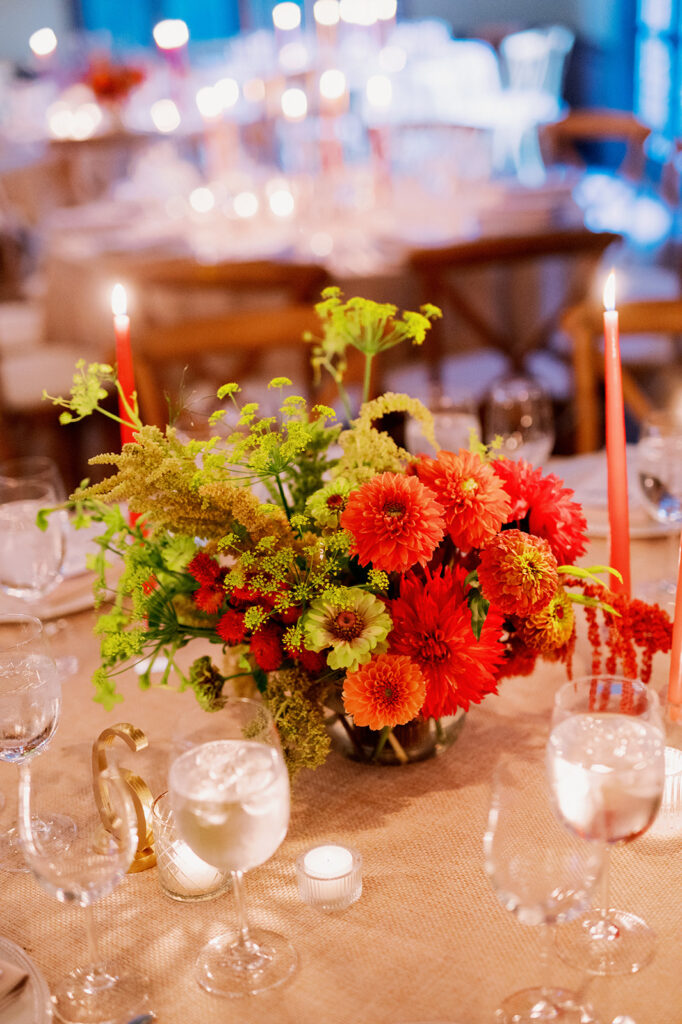 Vibrant wedding reception floral centerpiece.