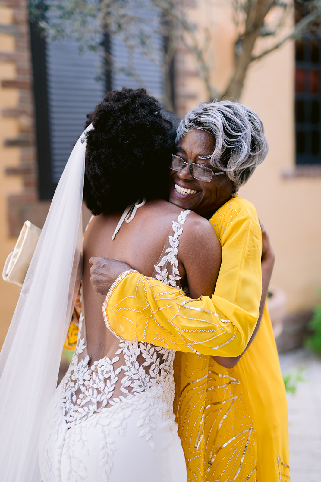 Bride hugging her grandma after a sweet first look.