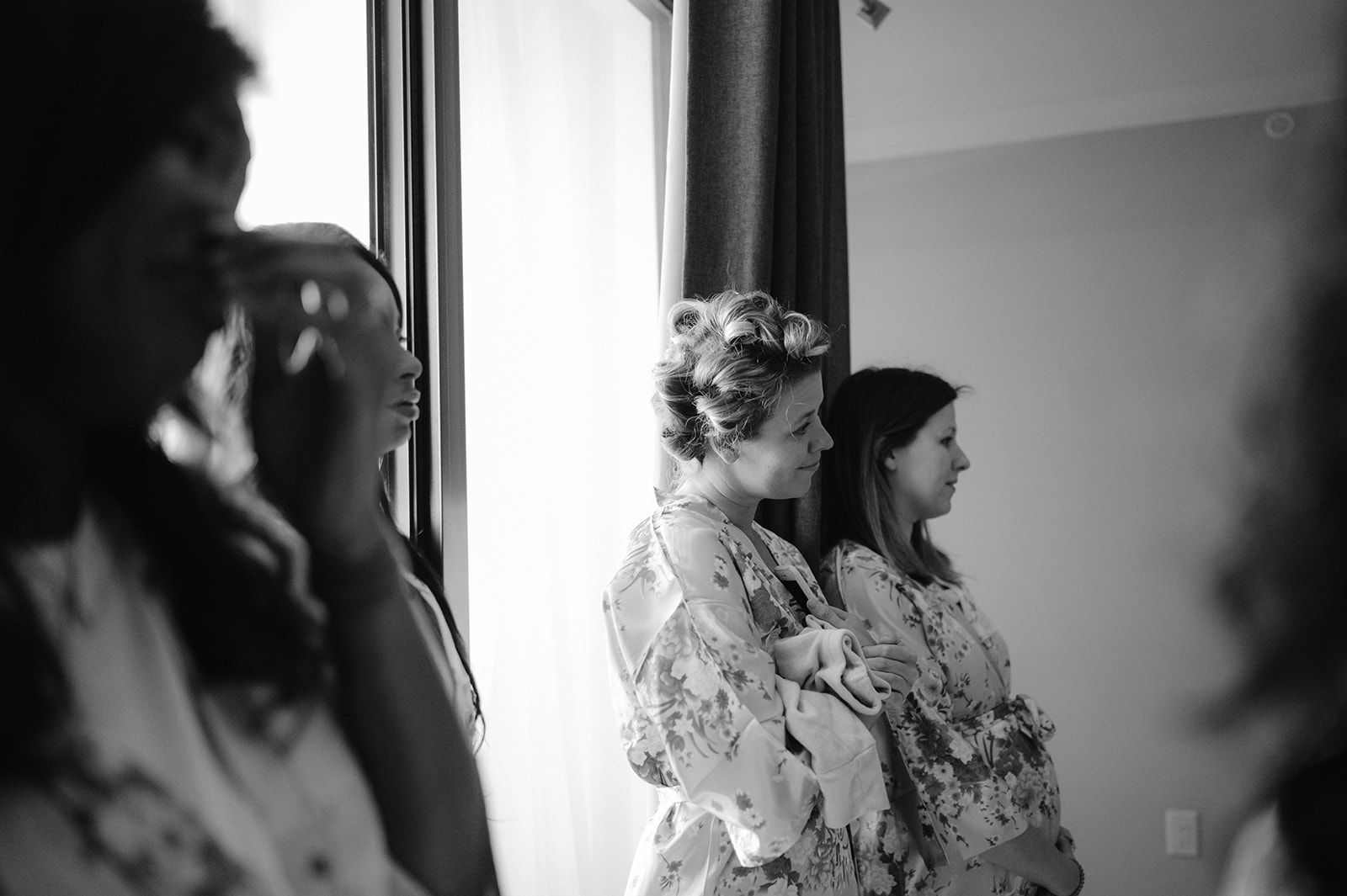 Candid documentary-style portrait of bridesmaids after the first look with the bride.