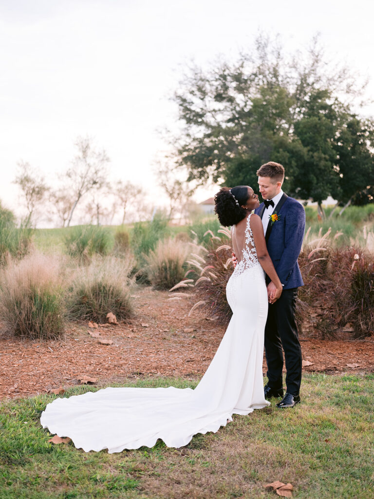 Bride and groom golf course sunset photos at Bella Collina in Orlando, Florida.