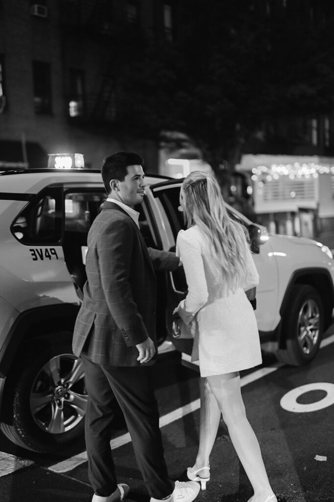 New York City couple getting into a Taxicab. 