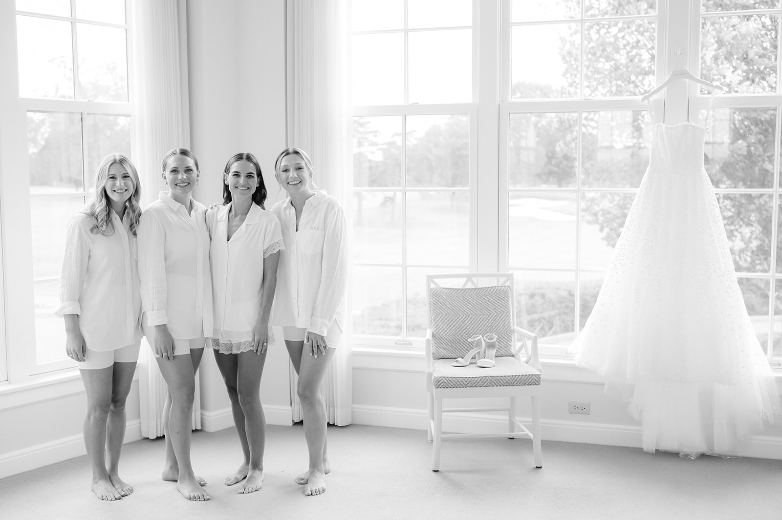 Black and white portrait of Carly and her bridesmaids in the Minikahda Club bridal suite.