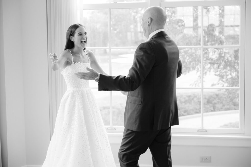 Carly's first look with her dad in the Minikahda Club bridal suite.