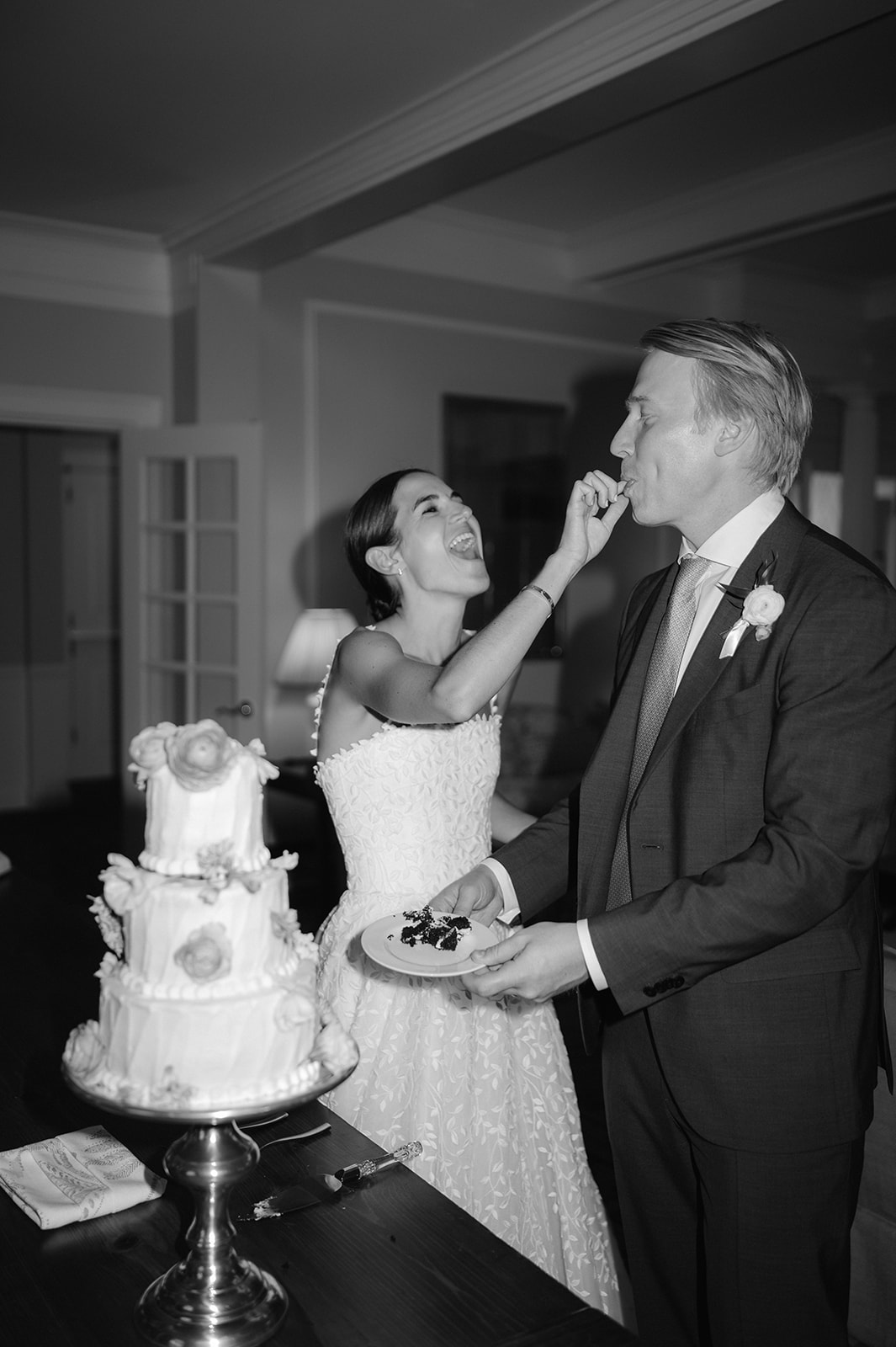 Black and white bride and groom cake cutting ceremony. 