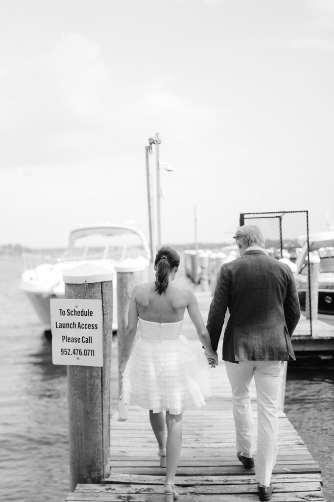 Bride and groom welcome party portraits on the dock on Lake Minnetonka. 