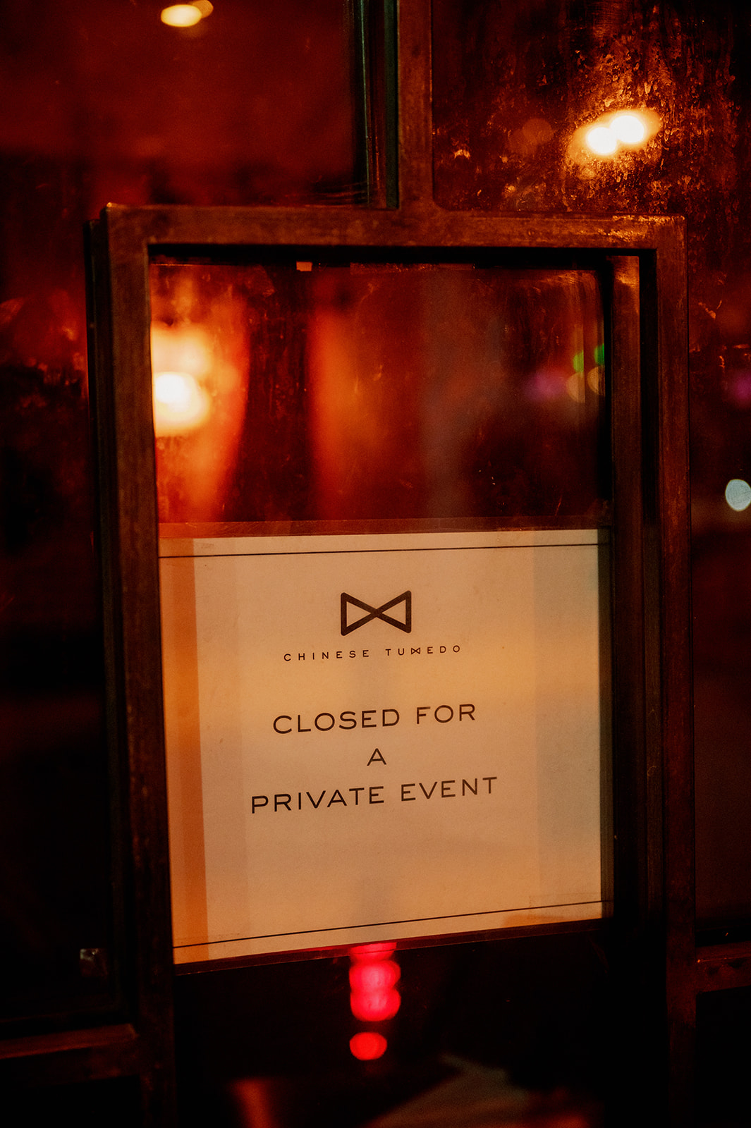 Peachy's Bar "closed for private event" sign in Chinatown.