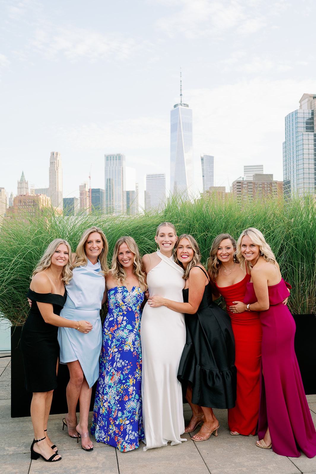 Tribeca Rooftop wedding bride posing with her group of friends at cocktail hour.