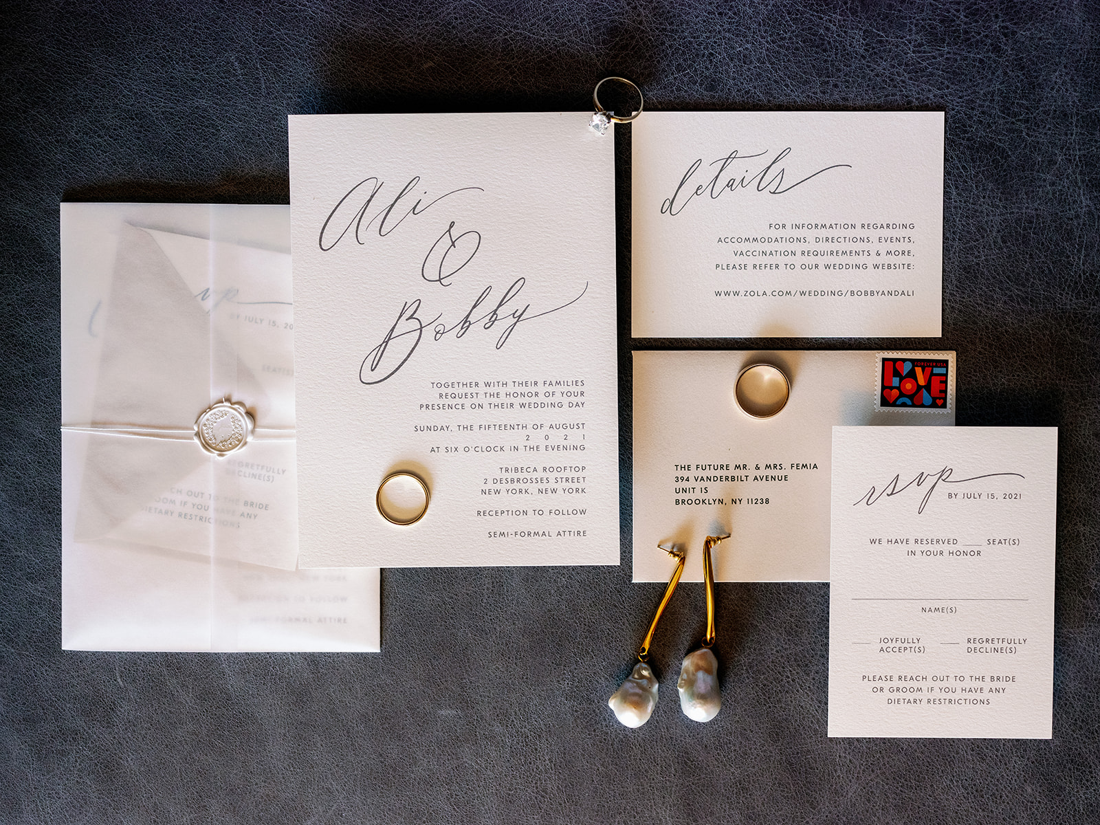 Elegant and modern wedding invitation suite and bridal details arranged in a chic flat lay, captured by New York wedding photographer Katherine Marchand. 