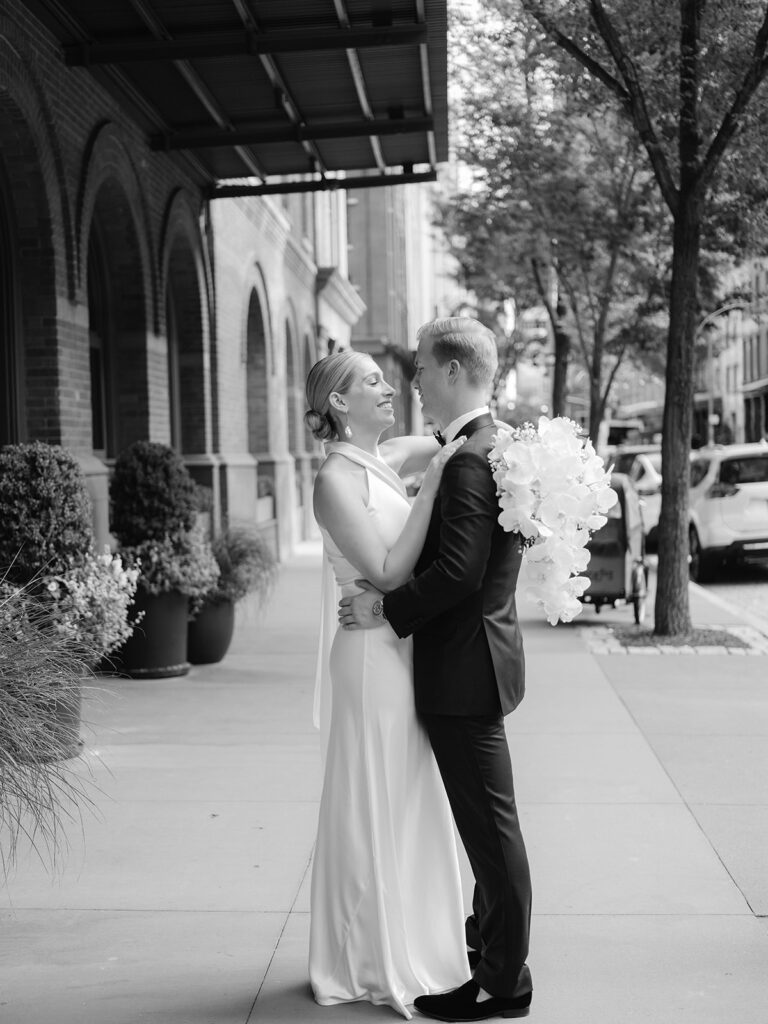 West Village bride and groom, in fine art black and white, candidly gaze into each other's eyes.
