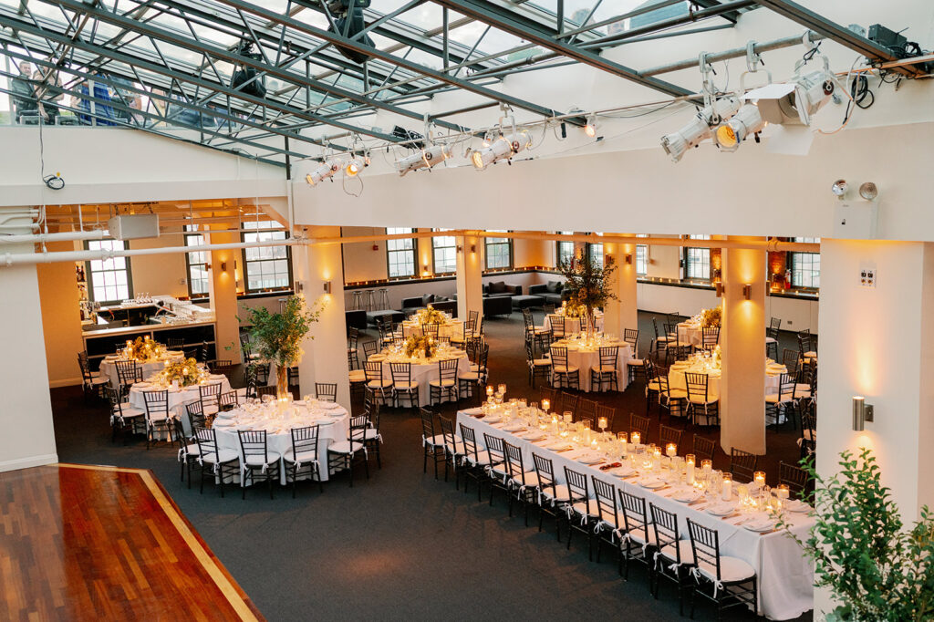 Tribeca Rooftop wedding reception balcony view, showcasing dinner tables. 