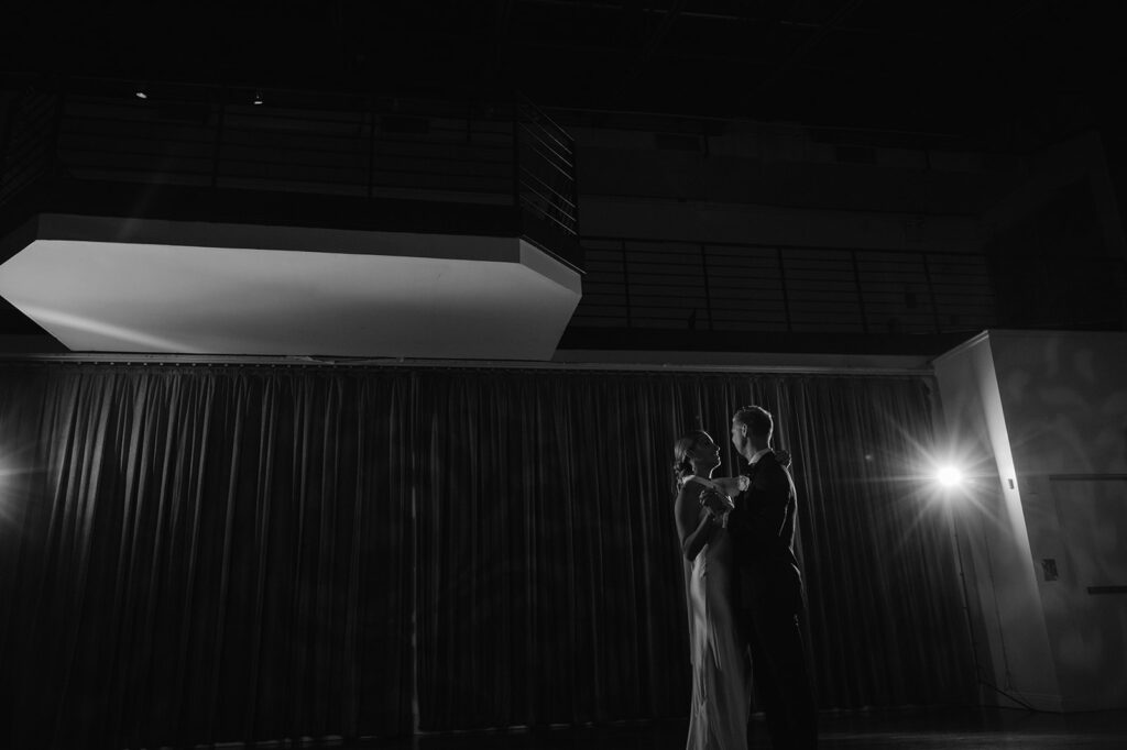 Cinematic black and white Tribeca Rooftop wedding first dance portrait.