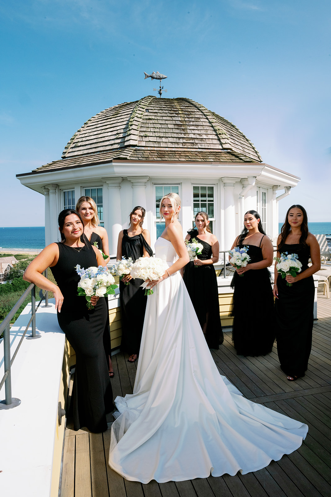 Editorial bride and bridesmaid portrait on the balcony of the Carousel Suite at Ocean House. 