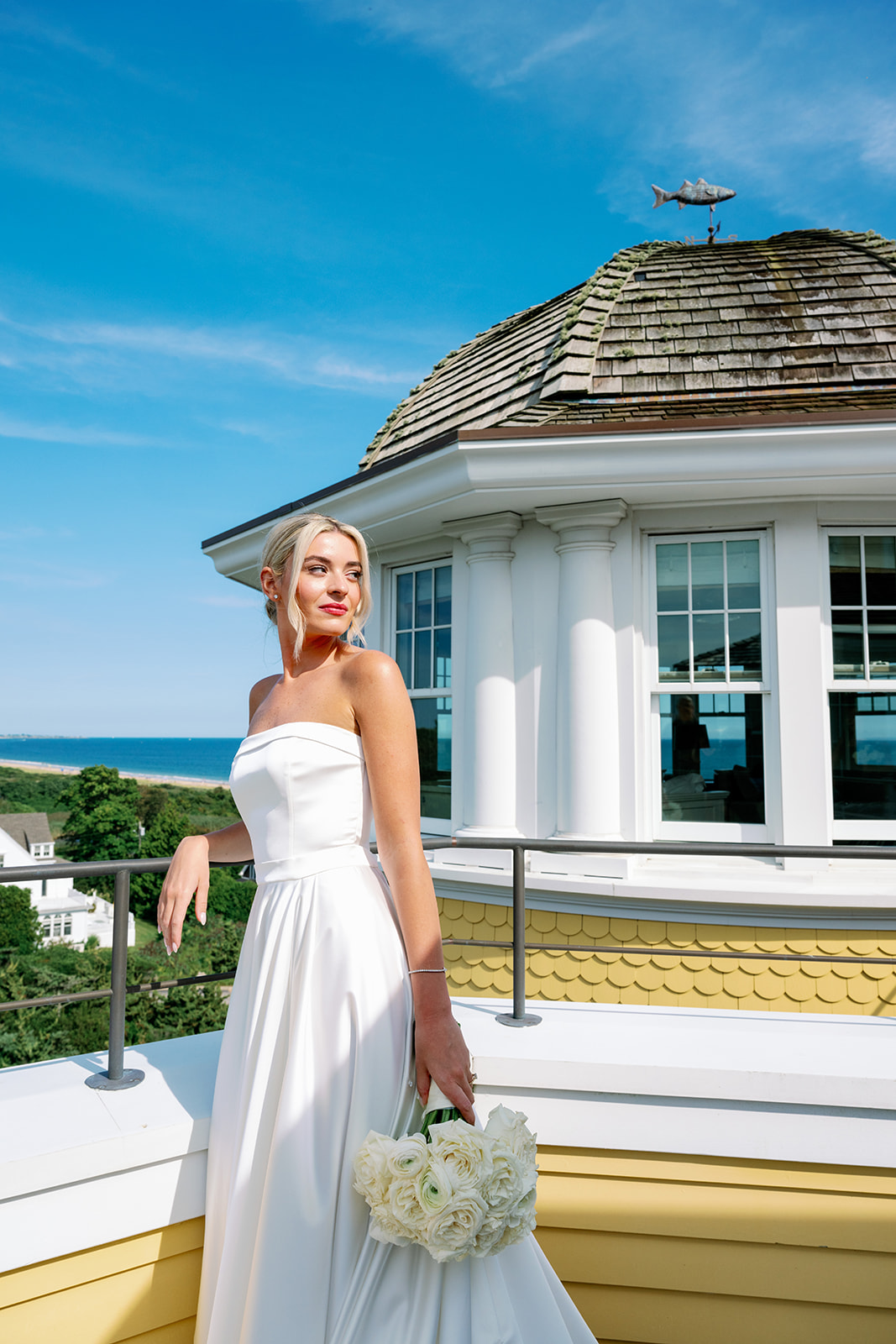 Posed bridal portrait on the balcony of the Carousel Suite at Ocean House. 