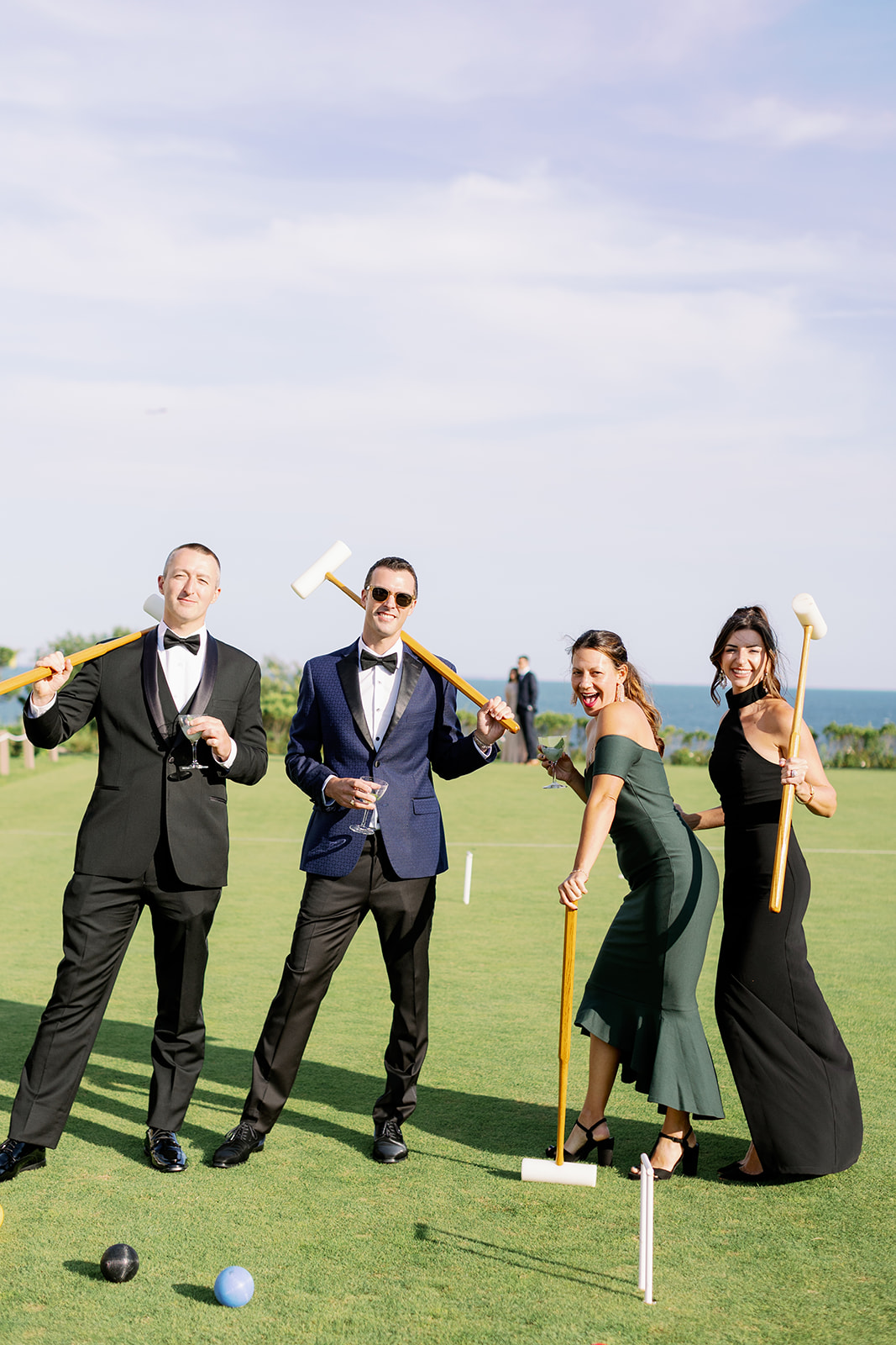 Wedding guests playing croquet at Ocean House. 