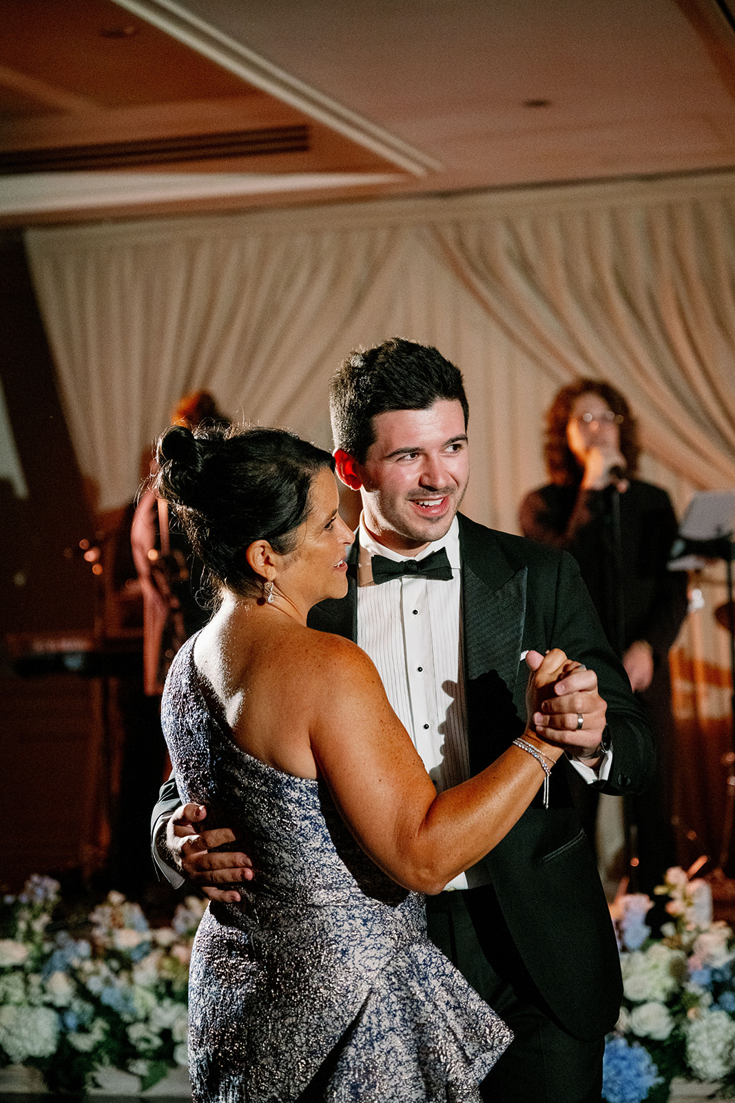 Candid portrait of a mother-son first dance at Ocean House. 