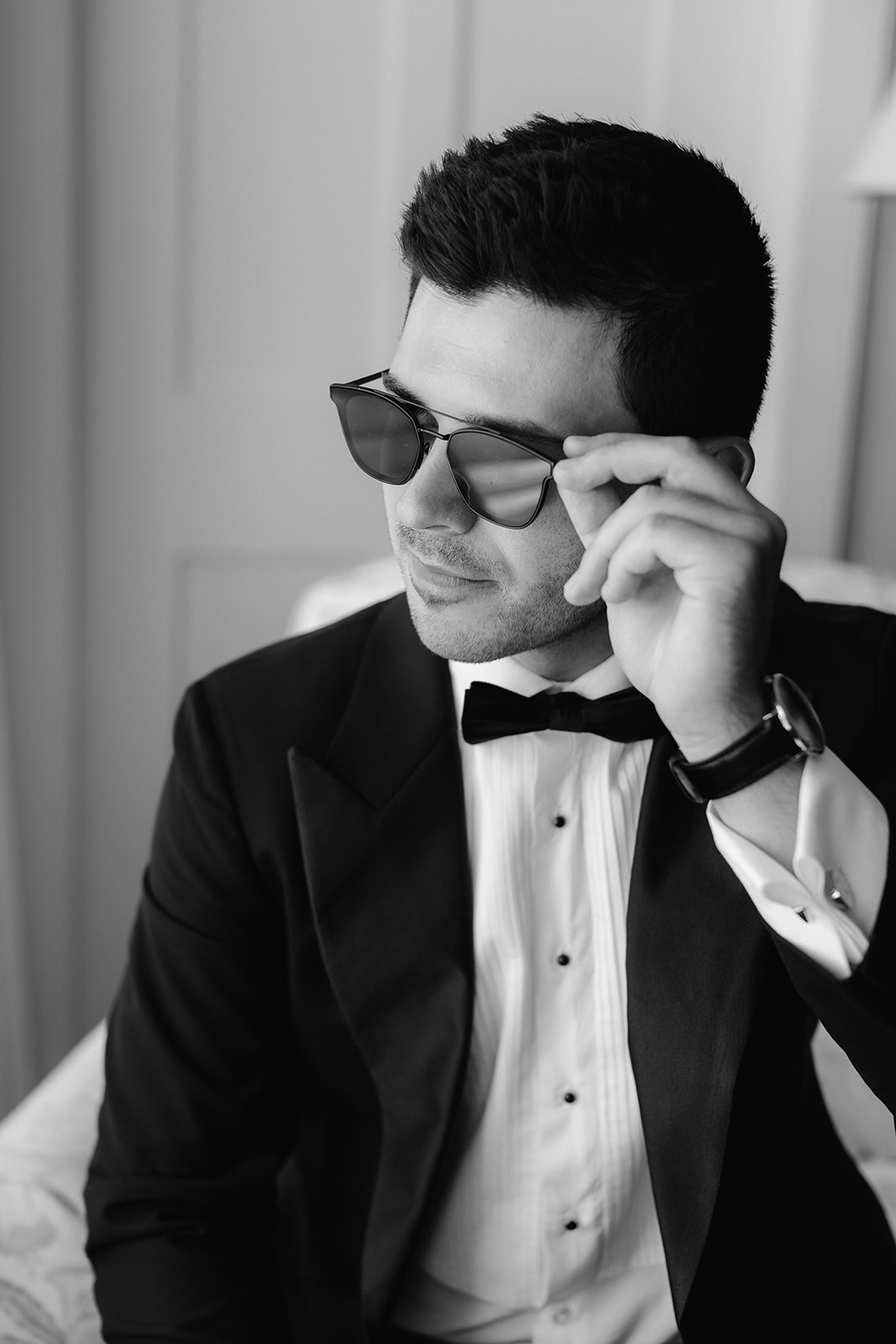 Black and white groom portrait wearing sunglasses. 