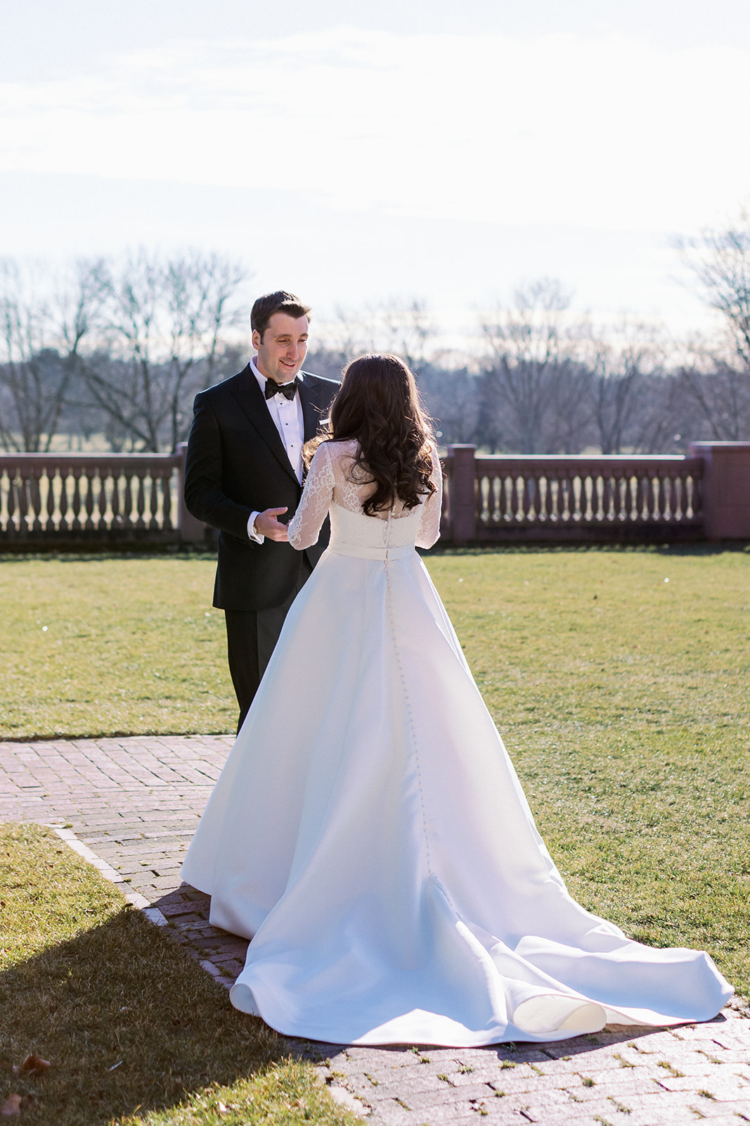 Bride and groom intimate first look moment at Pine Hollow Country Club.