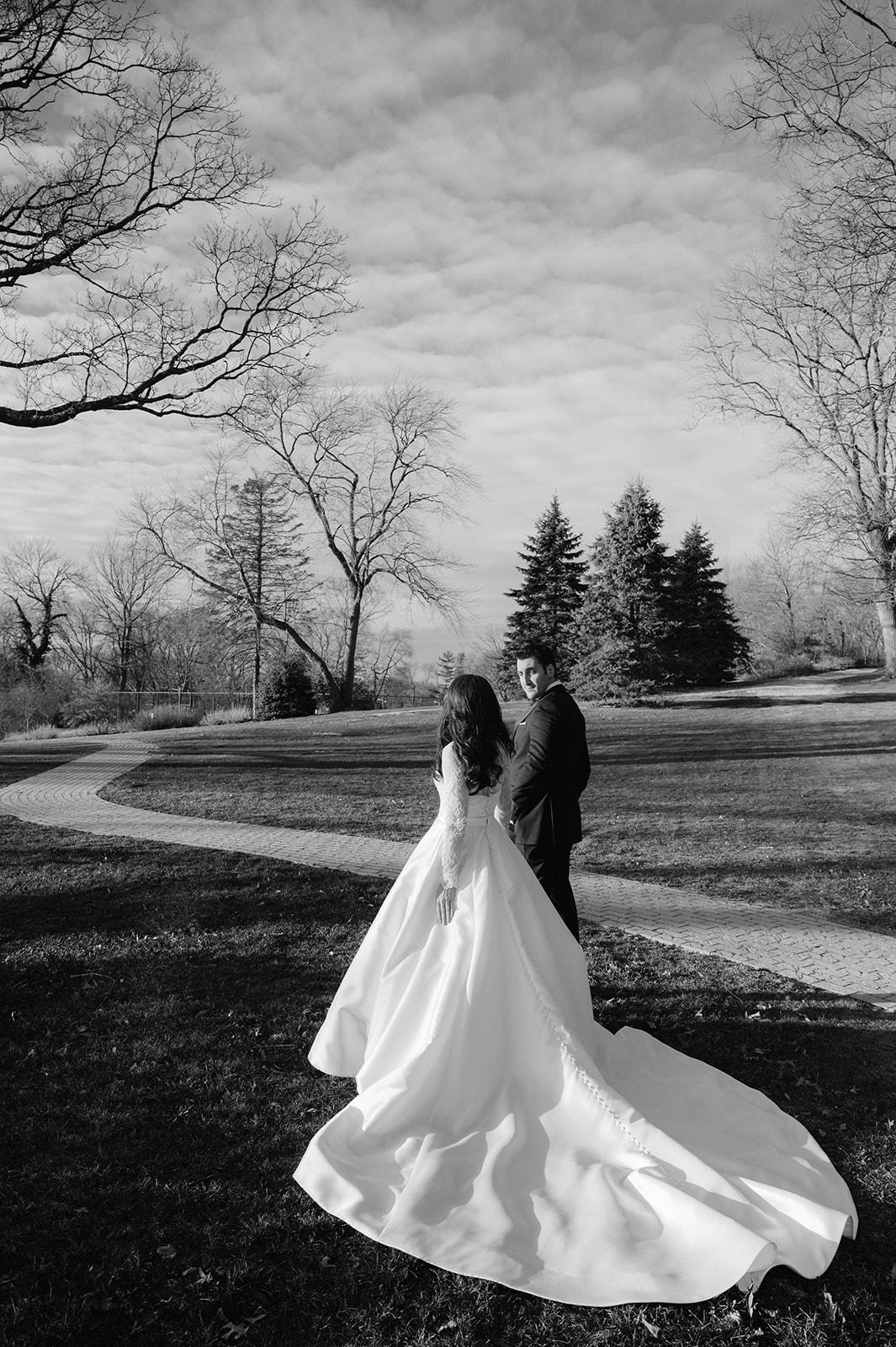 Candid walking bride and groom portrait at Pine Hollow Country Club.