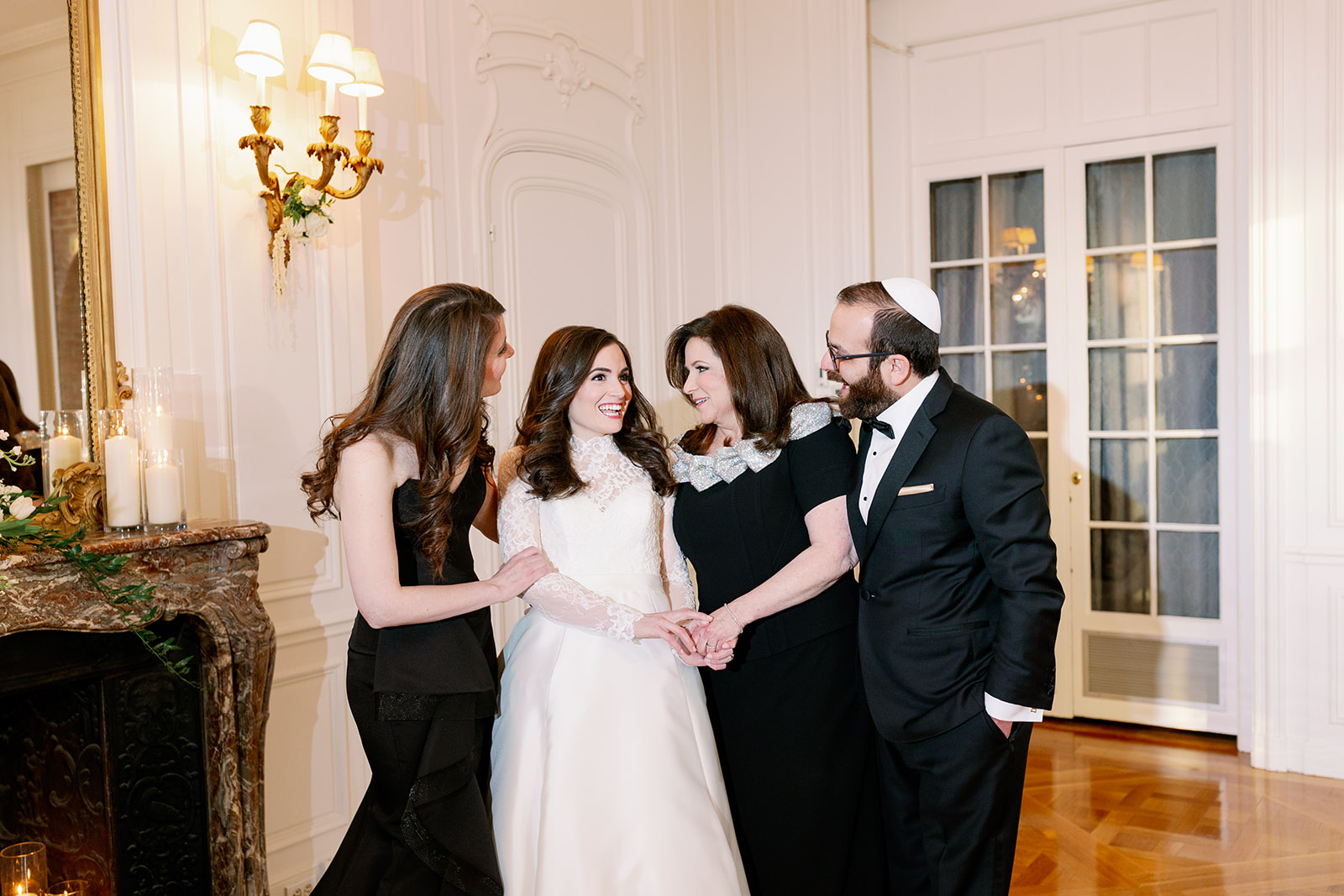 Candid moment of a bride and her family at Pine Hollow Country Club.