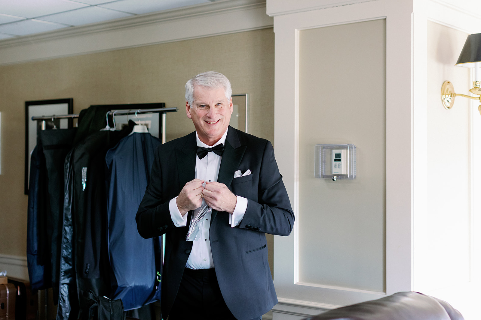 Posed moment of the groom's father in the men's locker room at Pine Hollow Country Club.