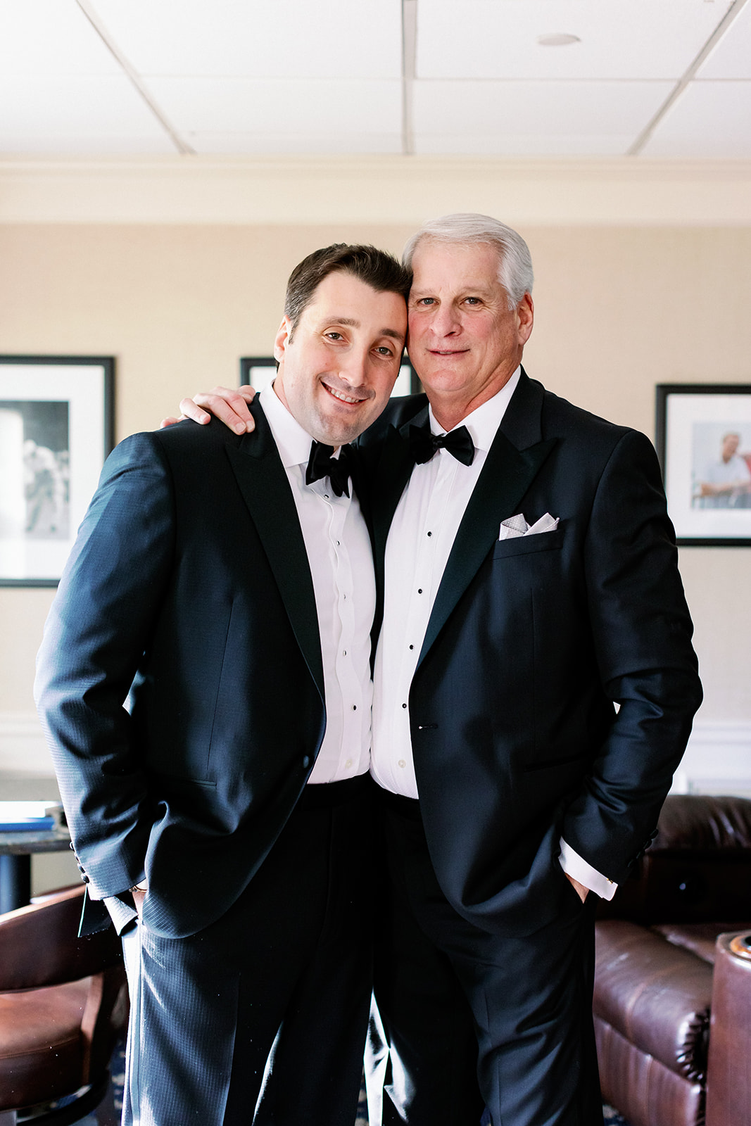 Posed moment between the groom and his father in the locker room at Pine Hollow Country Club. 