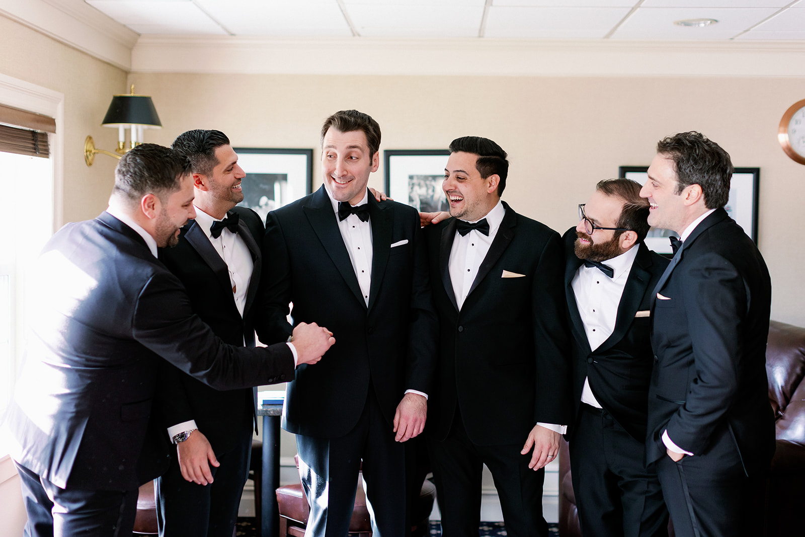 Groom and groomsmen candid group photo at Pine Hollow Country Club.