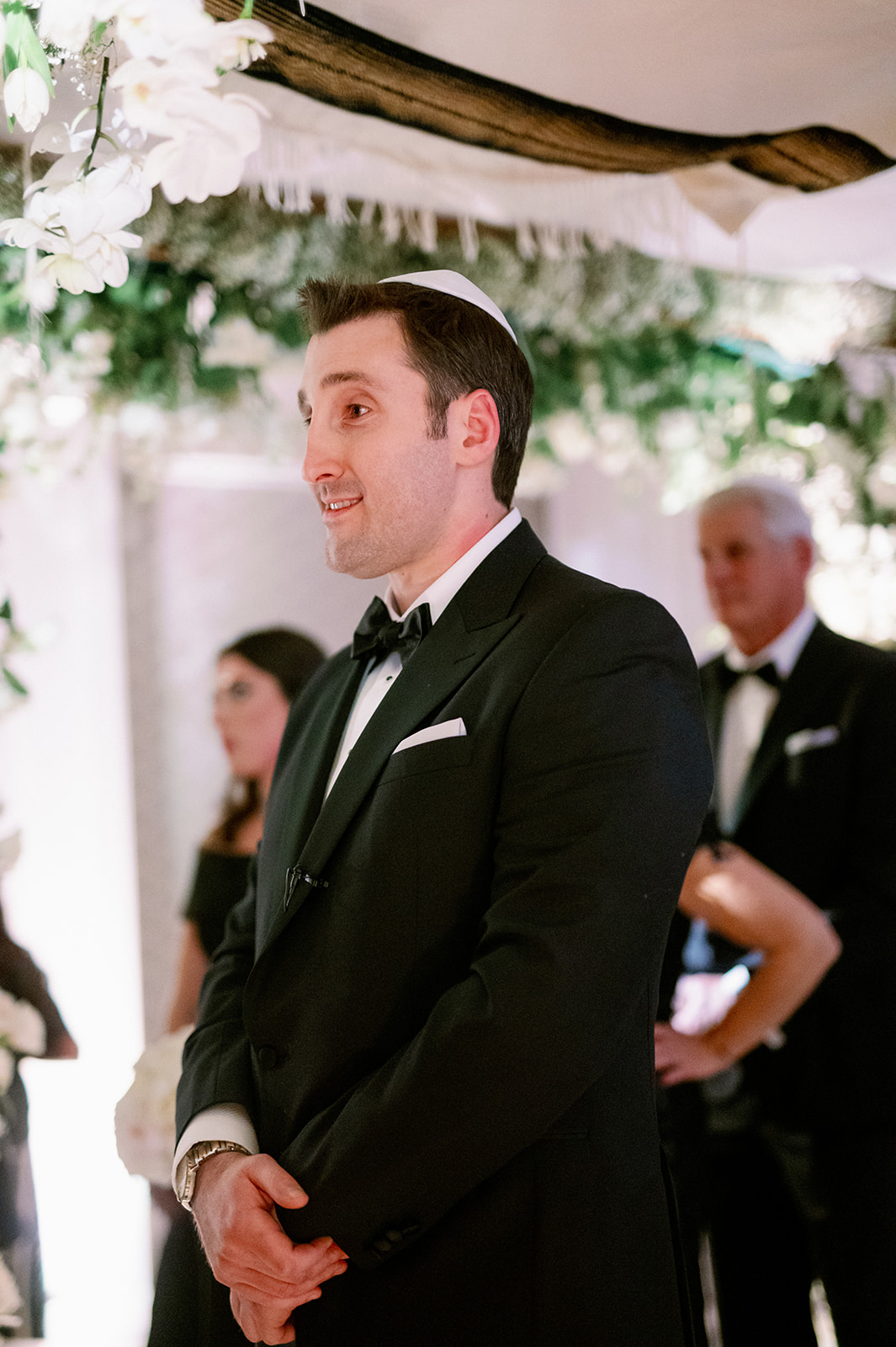 Groom reaction to bride walking down the aisle. 
