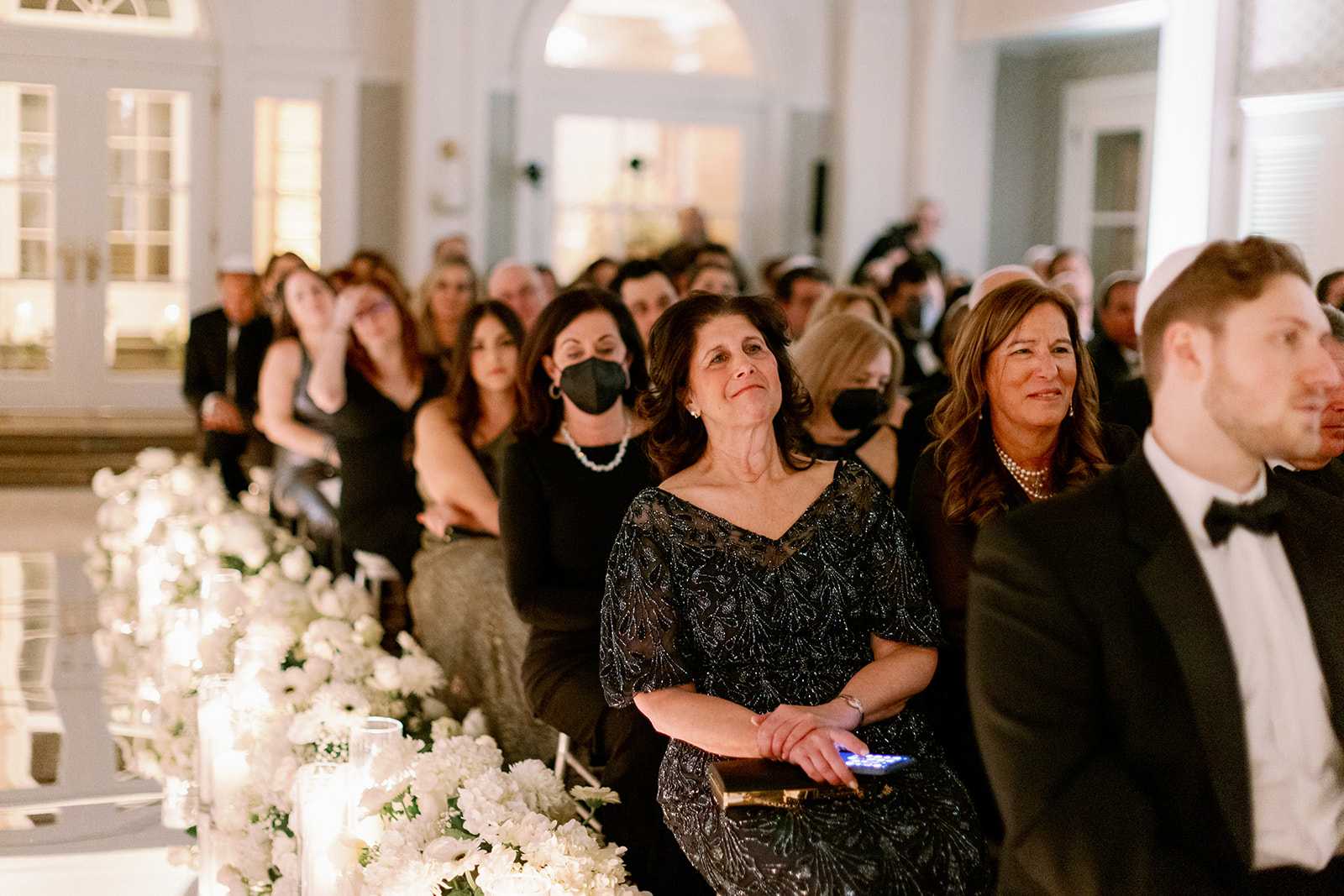Wedding guests get emotional while watching the ceremony.