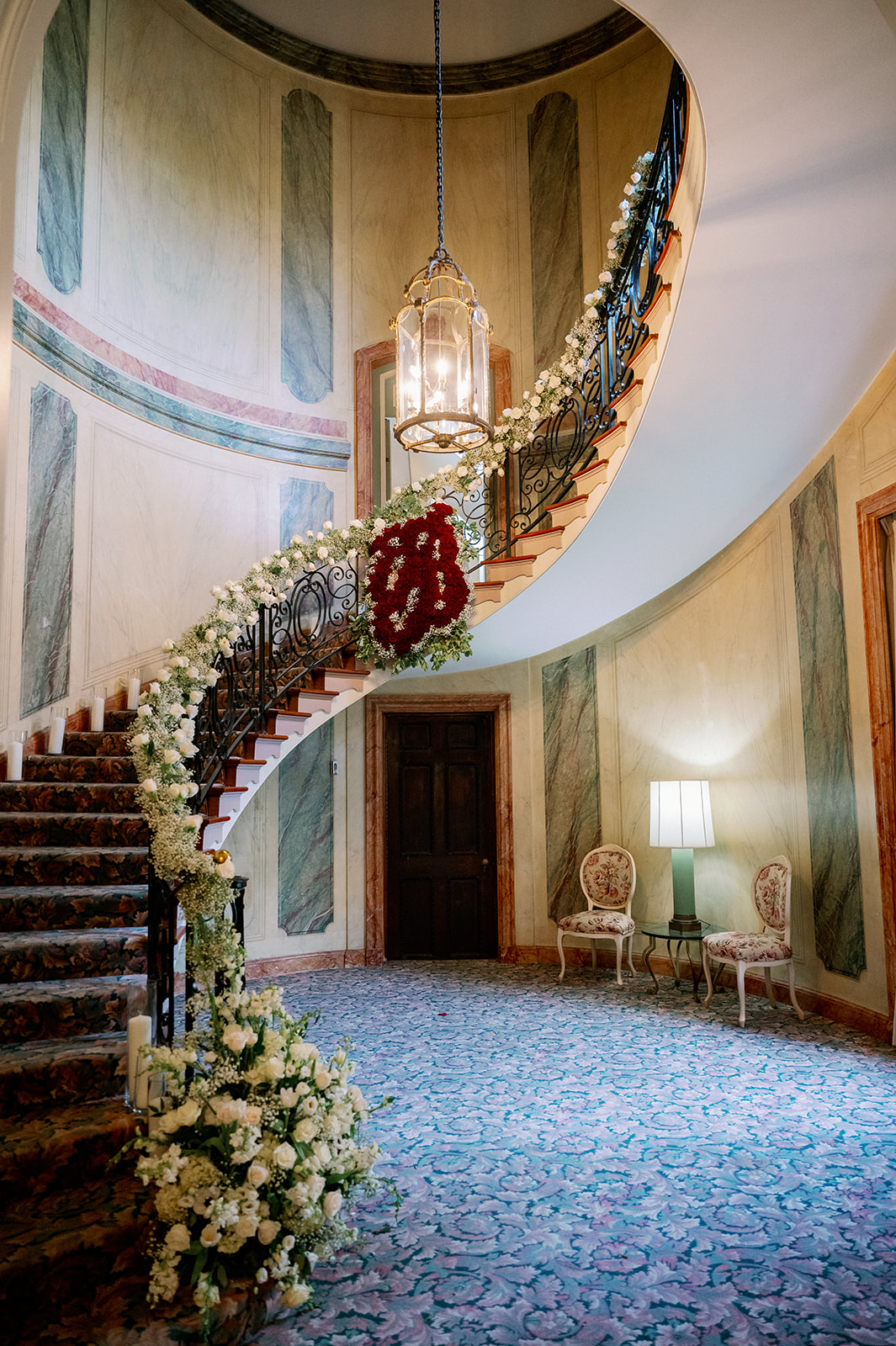 Pine Hollow Country Club floral lined grand staircase. 