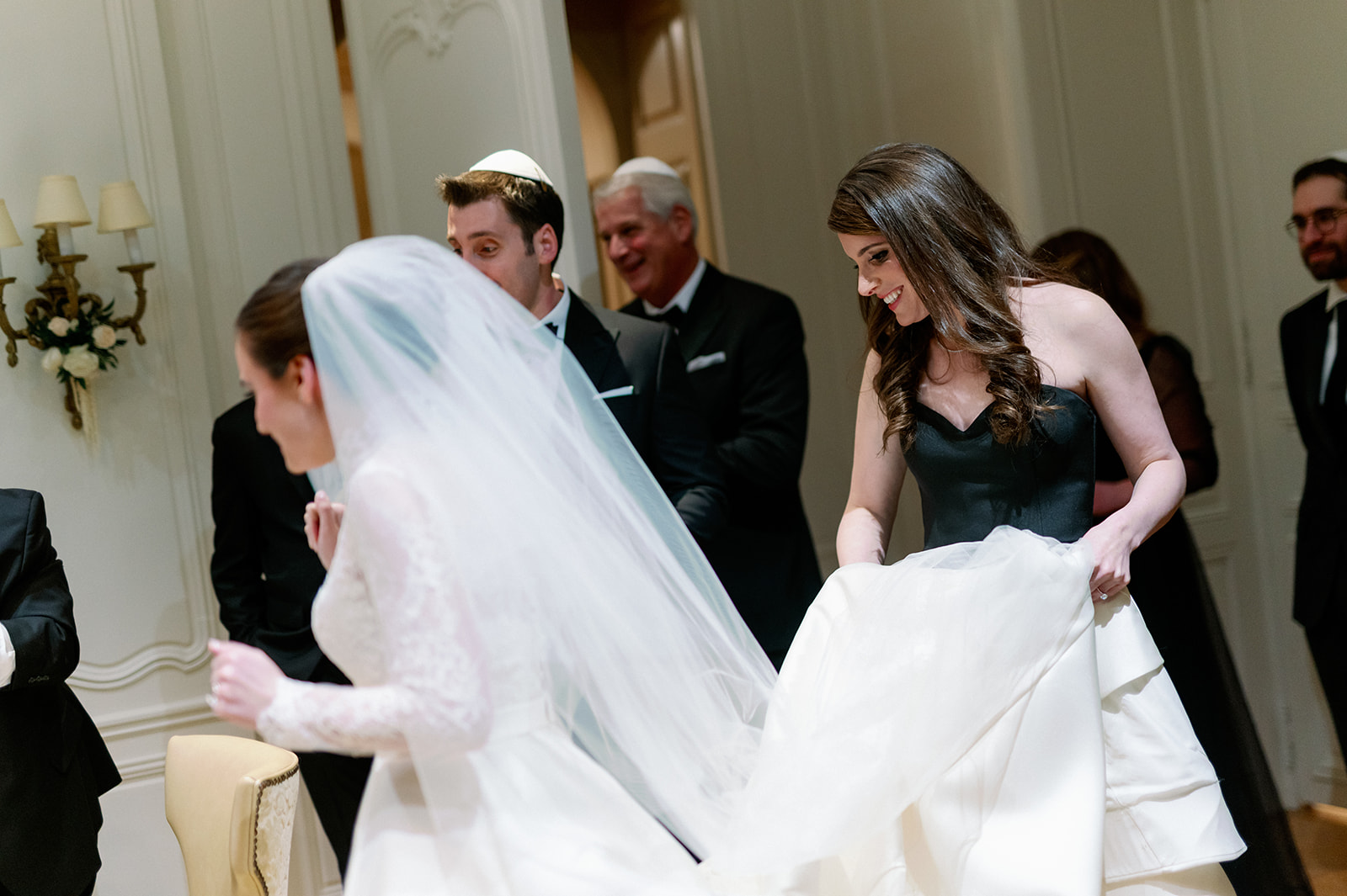 Bride entering a side room for the Ketubah signing at Pine Hollow Country Club.