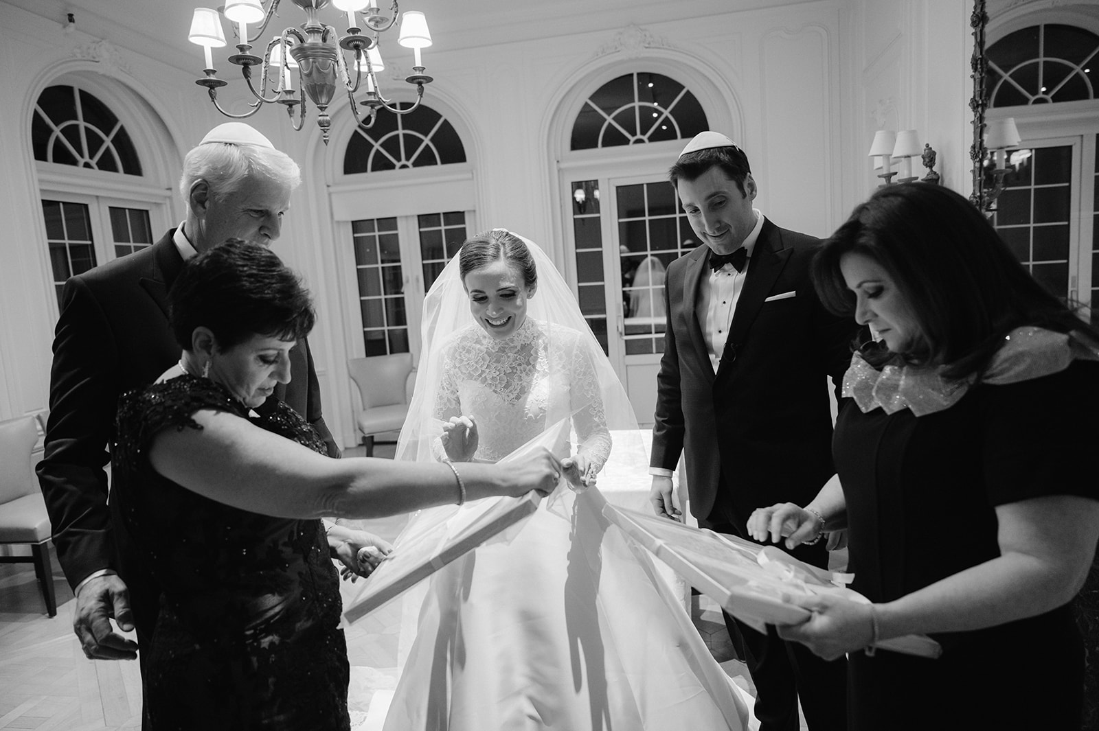 Bride and groom candid Ketubah signing at Pine Hollow Country Club.