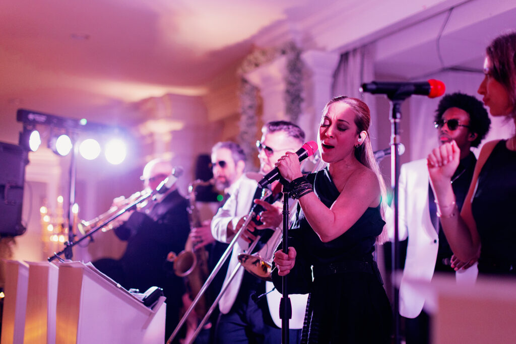 Live band playing at a luxury wedding reception at Pine Hollow Country Club. 