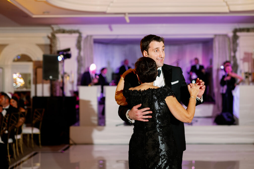 Groom dancing with his mom during Pine Hollow Country Club wedding reception.