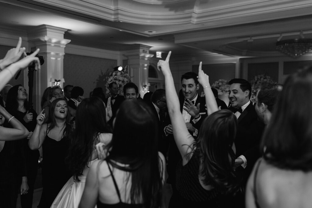 Wedding reception dance party candid photo at Pine Hollow Country Club.